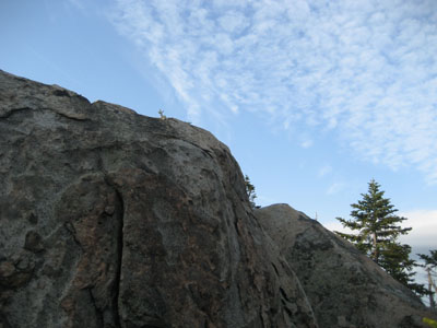 Blue sky emerges during the final scramble up The Horn