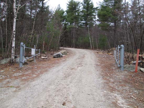 The Wolf Hill access road gate under the power lines
