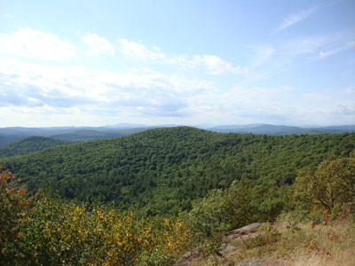 Looking northwest at the Ossipee and Sandwich Ranges from near the summit of Abbott Mountain - Click to enlarge