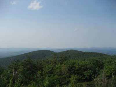Looking north toward Shawnee Peak from the Pleasant Mountain fire tower ladder - Click to enlarge