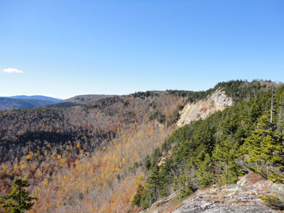 Looking at the east Red Rock ledges from ledges east of those east ledges - Click to enlarge