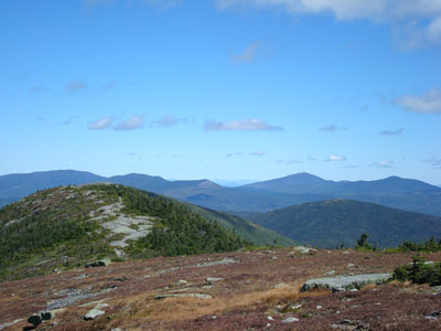 Looking northeast from the Saddleback Mountain summit at the Horn (just barely showing) and Sugarloaf Mountain, amongst others - Click to enlarge