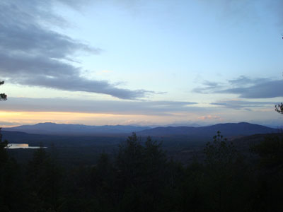 Looking at the Ossipees, Sandwich Range, and Green Mountain from the Wiggin Mountain vista - Click to enlarge