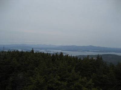 Looking at the Sandwich, Presidential, and Ossipee Ranges from the Belknap Mountain fire tower - Click to enlarge
