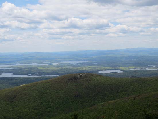 Looking over Turtleback Mountain at the Lakes Region from Black Snoot - Click to enlarge