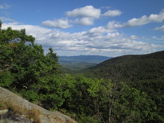 Looking southeast at the Ossipees from the southwestern ledges of Doublehead Mountain's North Peak - Click to enlarge