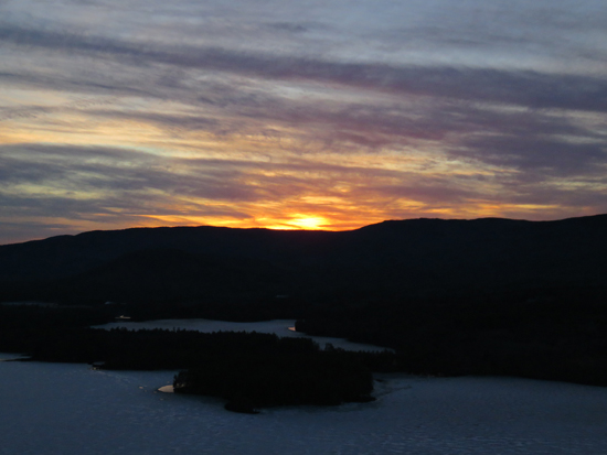 The sunset over Squam Lake as seen from one of the Eagle Cliff ledges - Click to enlarge