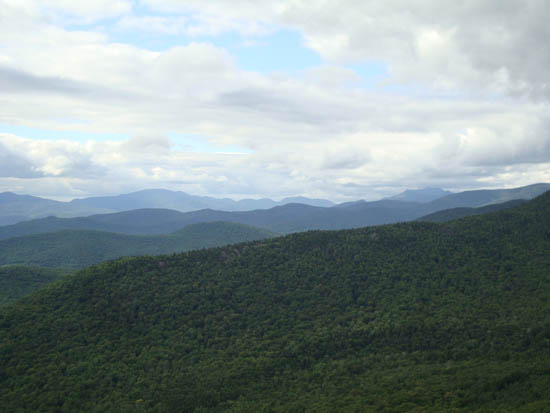 Looking at the Kinsmans and Franconia Ridge from near the summit of Fisher Mountain - Click to enlarge