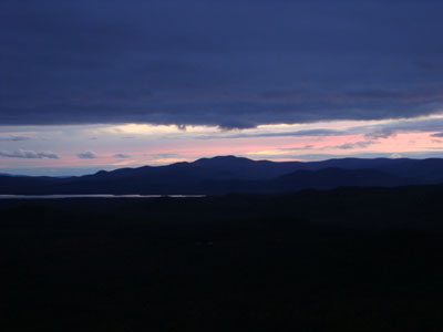 Looking at sunset colors behind Ossipees from the Foss Mountain north peak - Click to enlarge
