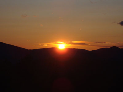 The sunset between Mt. Israel and the Sandwich Dome as seen from the Great Hill fire tower - Click to enlarge