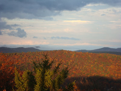 Looking northeast as fog lifts from south of Conway as seen from the Great Hill fire tower - Click to enlarge