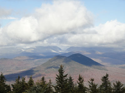 Looking at a white Carter Notch behind the Doubleheads from the Kearsarge North Mountain fire tower - Click to enlarge