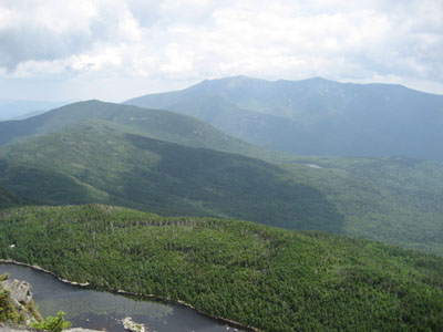 Hazy views of Cannon Mountain and the Franconia Ridge as seen from the ledge near the summit of Kinsman Mountain's North Peak - Click to enlarge