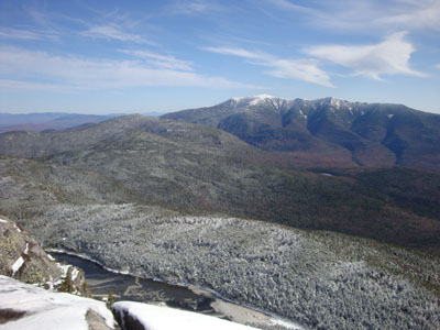 Kinsman Pond, Cannon Mountain, and the Franconia Ridge as seen from a ledge near the summit of Kinsman Mountain's North Peak - Click to enlarge