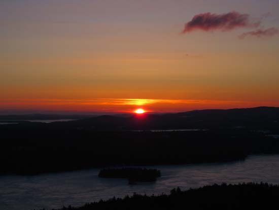 The sunrise over Lake Winnisquam from the Ladd Mountain ledge vista - Click to enlarge