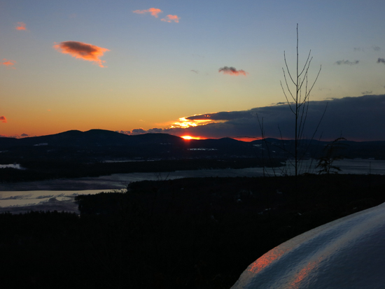 The sunrise over Lake Winnisquam from the Ladd Mountain ledge vista - Click to enlarge