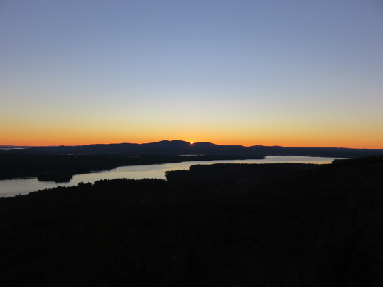 The sunrise over Lake Winnisquam from the Ladd Mountain ledge vista - Click to enlarge