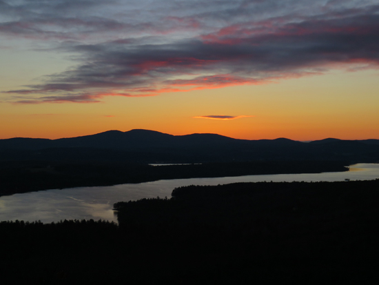 The sunrise over Lake Winnisquam from the Ladd Mountain ledge vista - Click to enlarge