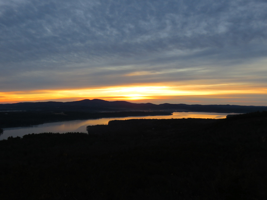 The sunrise over Lake Winnisquam from the Ladd Mountain ledge vista - Click to enlarge