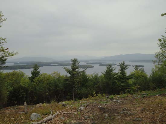 Looking across Lake Winnipesaukee at Red Hill and the Ossipees from the upper Lakeview Trail vista - Click to enlarge