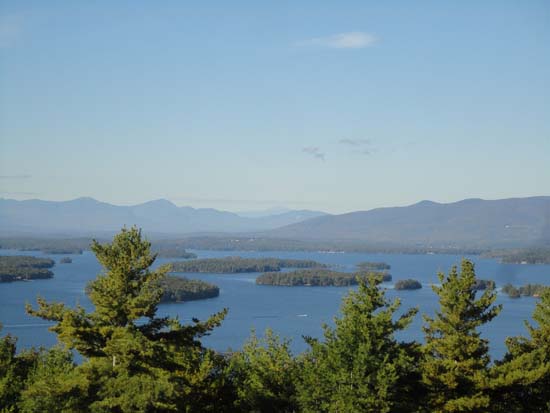 Looking over Lake Winnipesaukee at the Sandwich Range, Mt. Washington, and the Ossipees from the upper Lakeview Trail vista - Click to enlarge