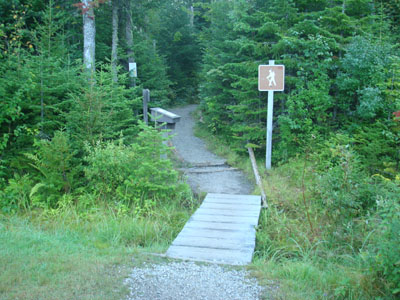 The Ammonoonusc Ravine Trail trailhead at the edge of the parking area