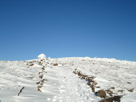 Looking up the Moosilauke Carriage Road with a near-full moon rising near the Mt. Moosilauke summit