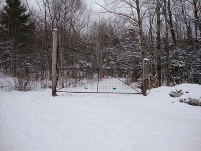 The Glencliff Trail trailhead at the edge of the parking area