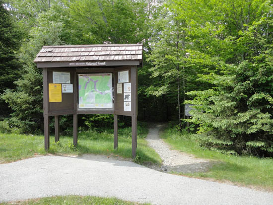 The Beaver Brook Trail trailhead at the edge of the parking area