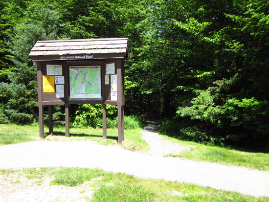 The Beaver Brook Trail trailhead at the edge of the parking area