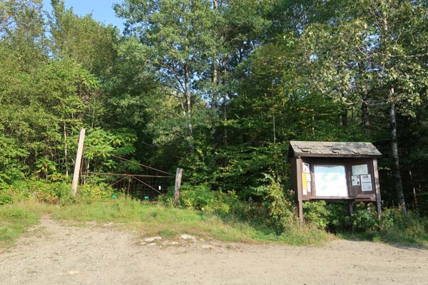 The Glencliff Trail trailhead at the edge of the parking area