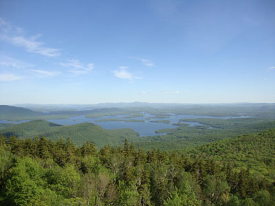 Looking at Squam Lake, Lake Winnipesaukee, and the Belknap Range from the Mt. Morgan ledges - Click to enlarge