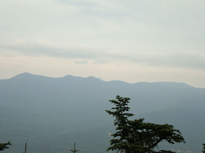Looking at the Tripyramids, Passaconaway, the Sleepers, and Whiteface from the Mt. Tecumseh summit vista - Click to enlarge