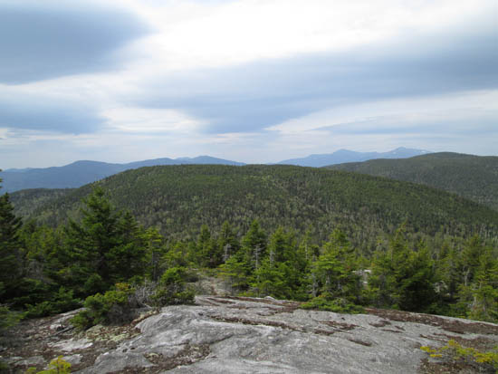 Looking at the Carter-Moriah and Presidential Ranges from the southern North Bald Cap ledges - Click to enlarge