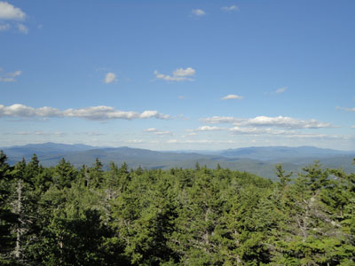 Looking east at the Sandwich, Squam, and Ossipee ranges from the viewpoint near the summit of Plymouth Mountain - Click to enlarge