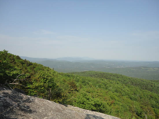 Looking east at Red Hill and the Ossipees from the ledges near the summit of Plymouth Mountain - Click to enlarge