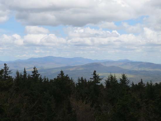 Looking over Mt. Prospect at the Sandwich Range from the ledges near the summit of Plymouth Mountain - Click to enlarge