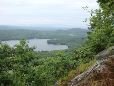 Looking over Dan Hole Pond out to the Belknaps from near the summit of Sentinel Mountain - Click to enlarge