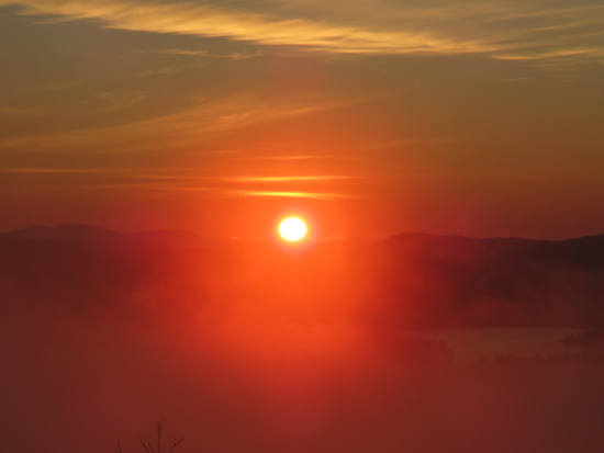 The sunrise over Newfound Lake as seen from near the summit of Sugarloaf - Click to enlarge