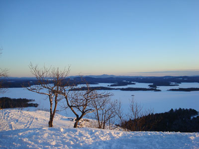 Looking southeast across Squam Lake toward the Belknap Range from West Rattlesnake - Click to enlarge