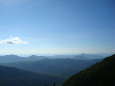 Looking southeast from Wildcat A at the Doubleheads, Kearsarge North, and in the distance, Pleasant Mountain - Click to enlarge